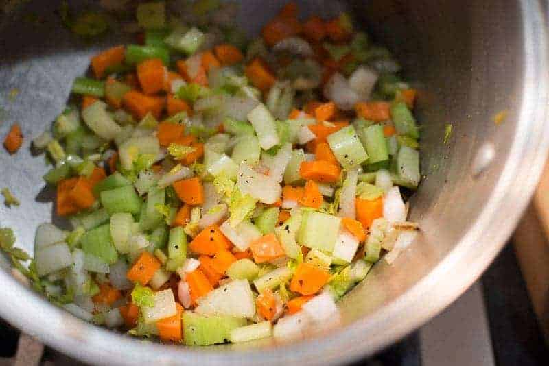 Mirepoix: Carrots, celery, onions in a soup pot.