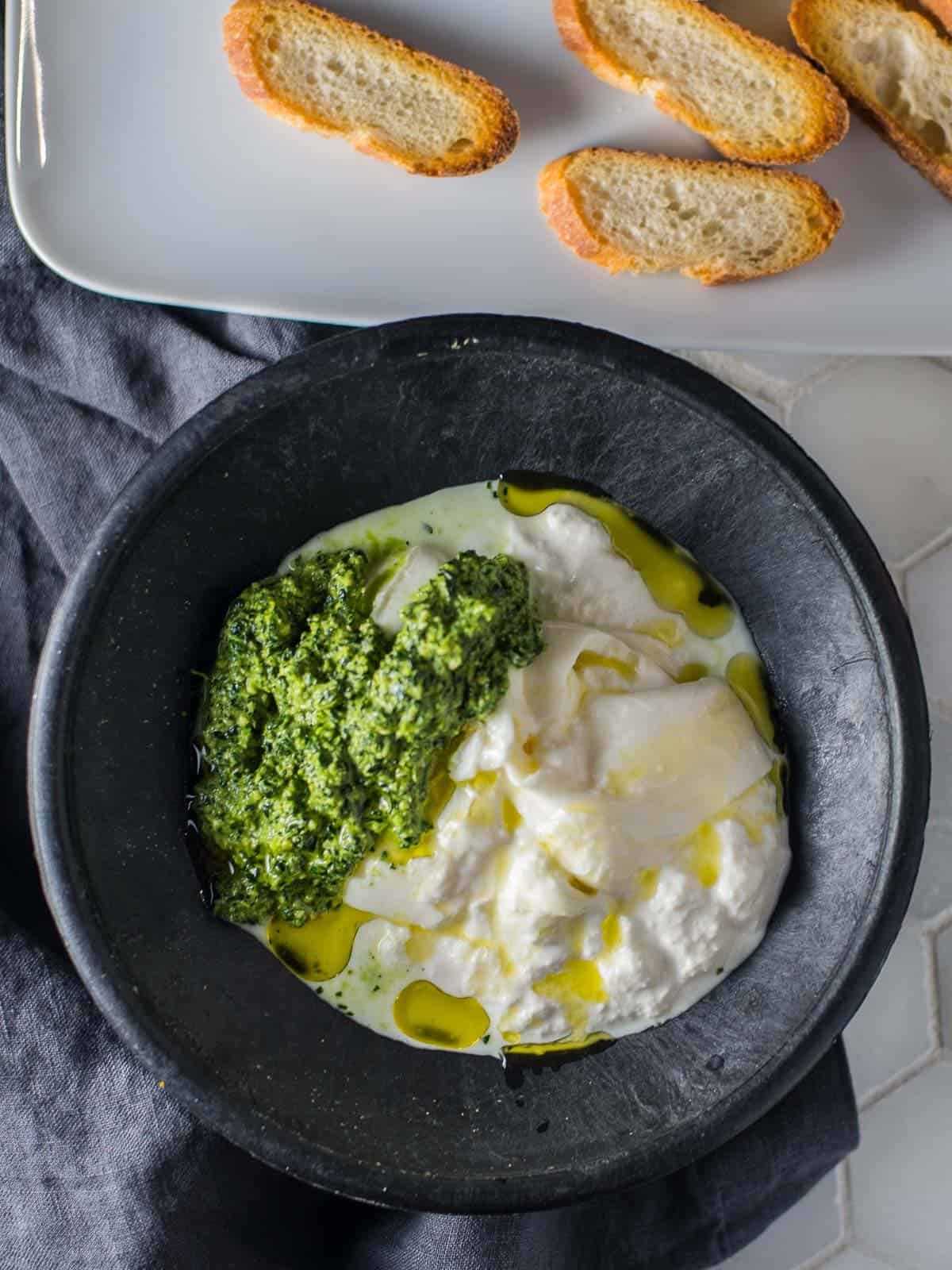 burrata with crostini and kale pesto