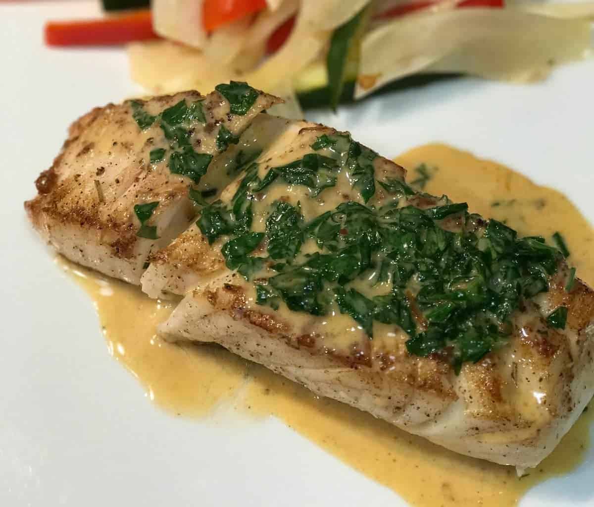 Pan Seared Halibut With Citrus Cream Sauce recipe by foodology geek.