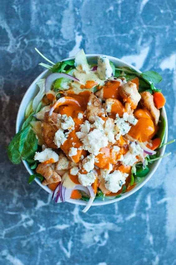 Buffalo chicken salad bowl with blue cheese and franks' red hot sauce. by foodology geek