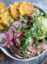 Steak salad with chimichurri sauce, guacamole, and tostones. by foodology geek