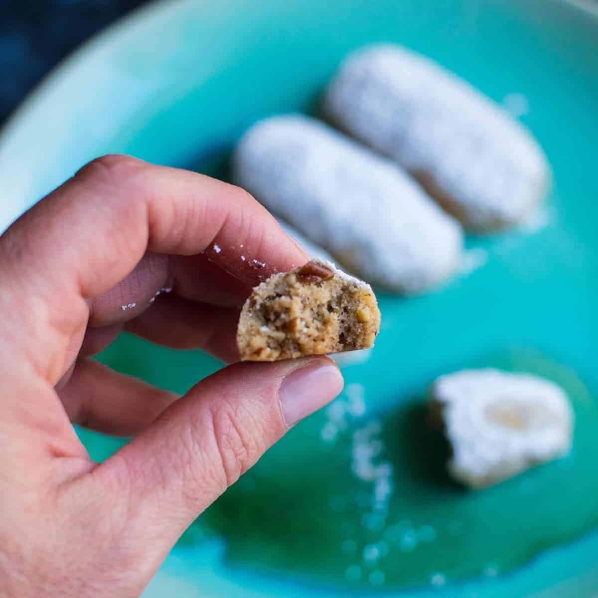 Pecan cookies coated with powdered sugar. by foodology geek