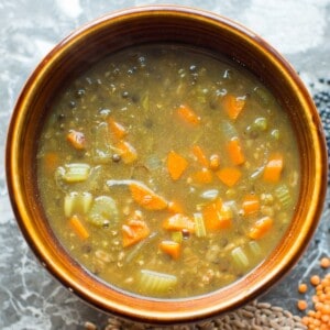 vegan lentil stew made with red and black lentils and farro