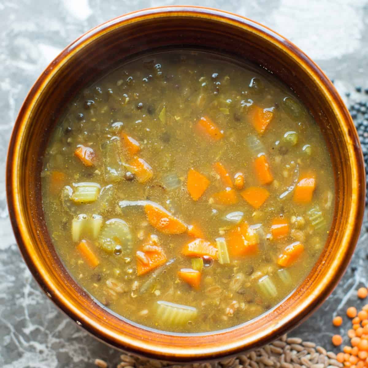 vegan lentil stew made with red and black lentils and farro