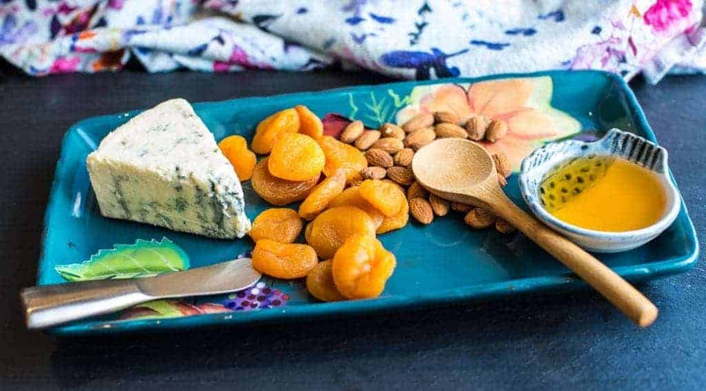 Don't eat crackers? Put your cheese on dried apricot. Add an almond and some honey!