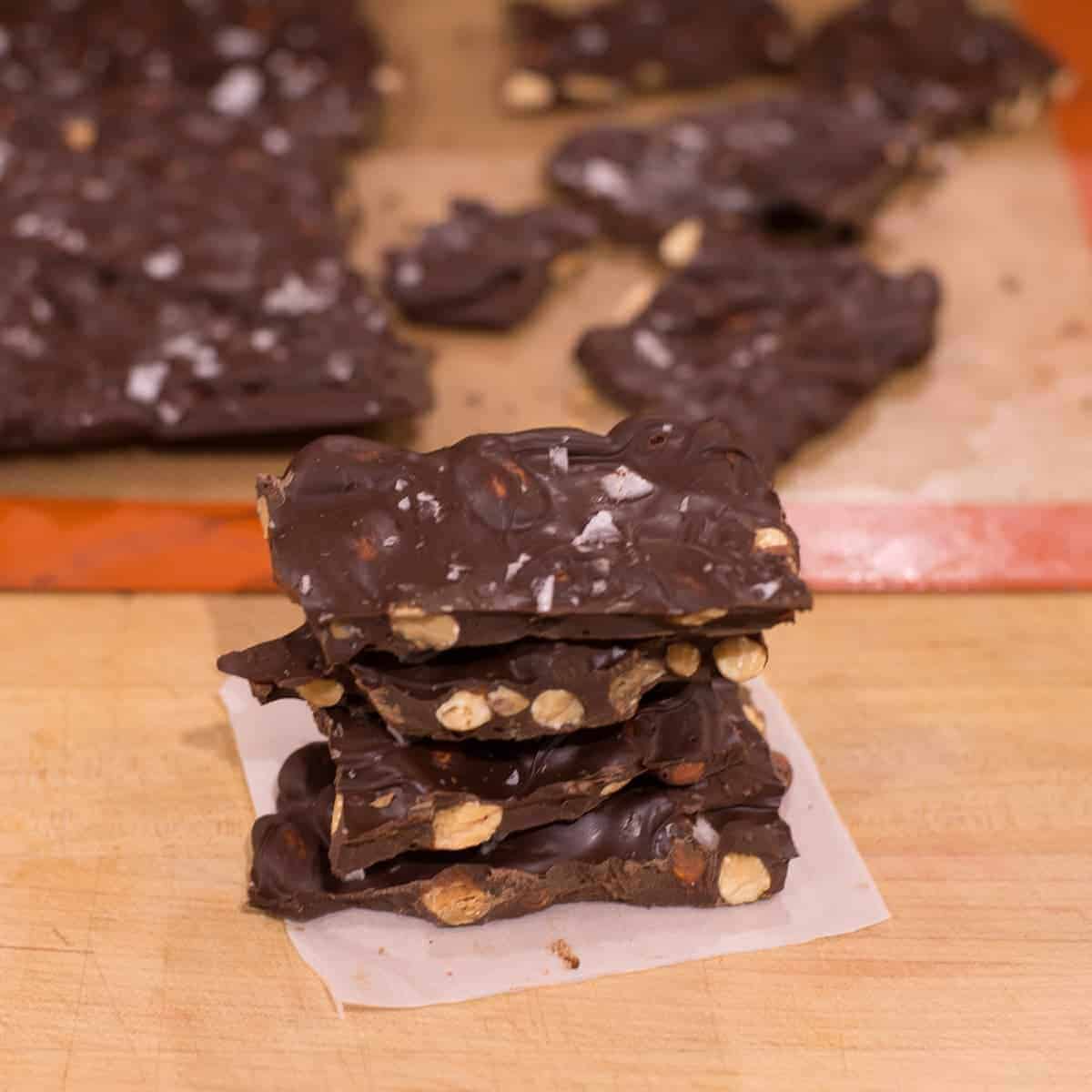 Stack of dark chocolate salted almond bark