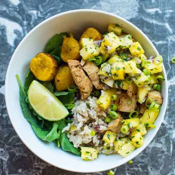 Jerk Chicken Bowl #jerkchicken #jamaican #pineapple #salsa #plantains #riceandbeans Spicy Jerk Chicken served with roasted plantains and Jamaican rice and peas.