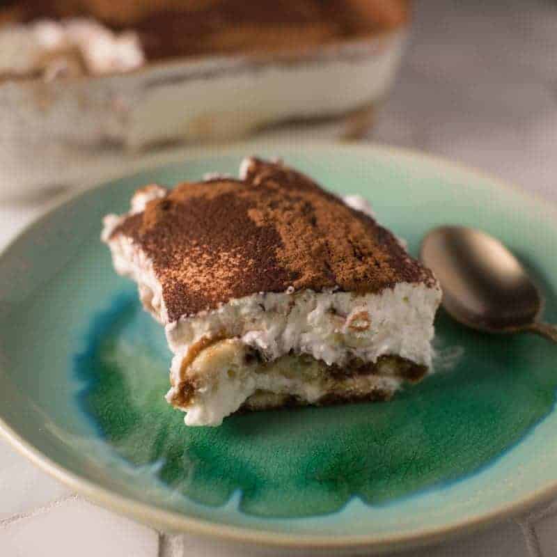 A slice of tiramisu cake a no bake recipe by foodology geek