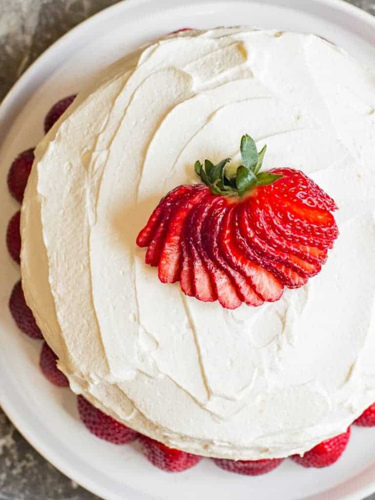 Fresh Strawberries and Cream Cake with whipped cream frosting