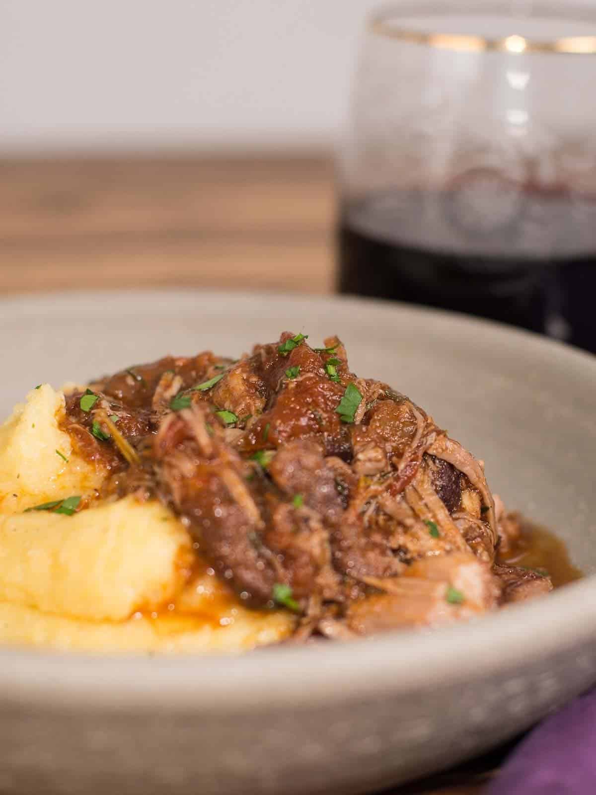 serve pork ragu with creamy polenta and a dry italian red wine.