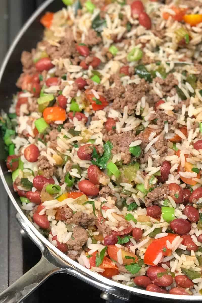 Puerto Rican Dirty Rice Recipe made with ground beef, small red beans, puerto rican sofrito and fresh veggies. to