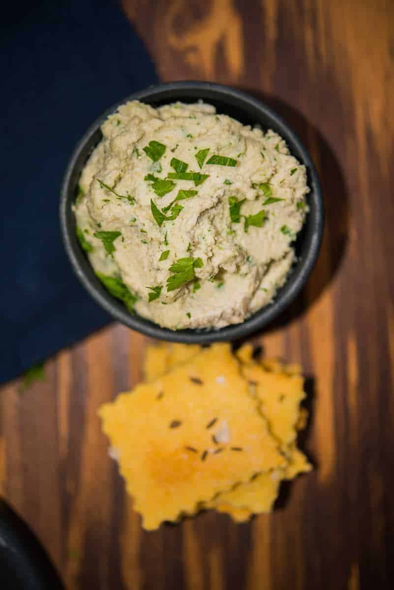 Smooth and creamy cashew cheese with herbs and garlic.