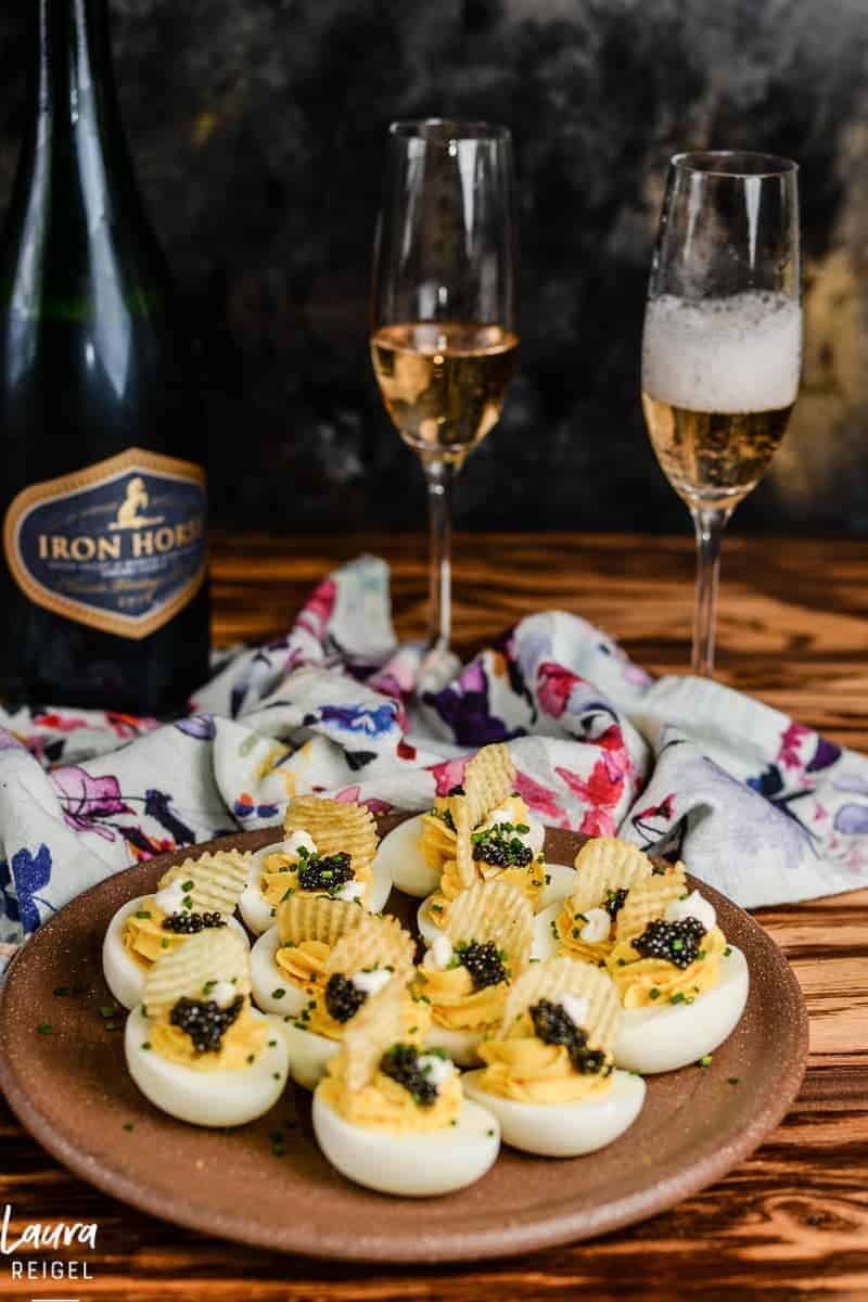 Deviled eggs with caviar and potato chips. Always serve with champagne.