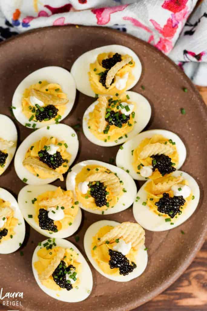 Deviled eggs with caviar and potato chips.