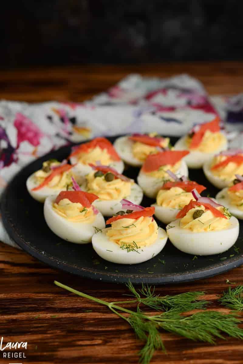 Deviled eggs with smoked salmon, capers and pickled red onions