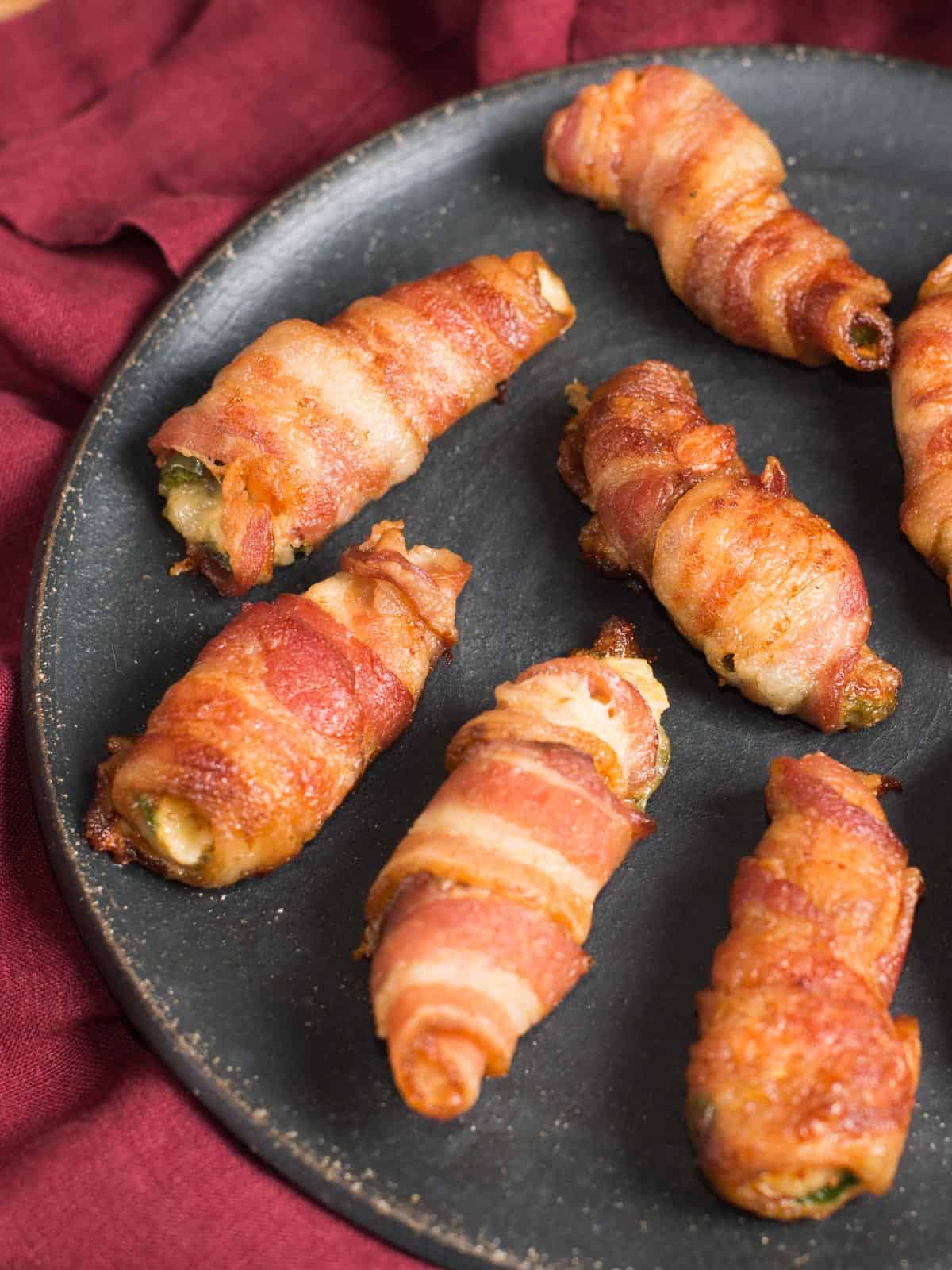 plate of jalapeno poppers stuffed with buffalo seasoned shrimp