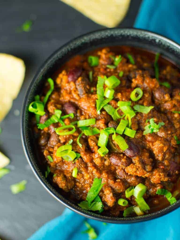 Easy chili recipe topped with fresh green onions.