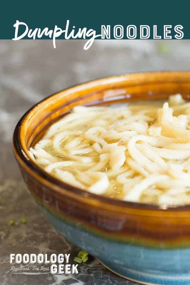 Homemade dumpling noodle in a bowl with fresh chicken broth. Pinterest image by foodology geek.
