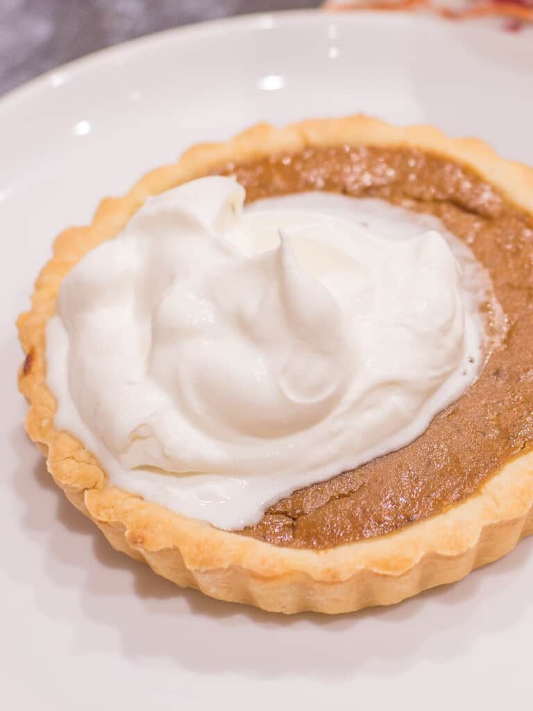 mini pumpkin pies with whipped cream