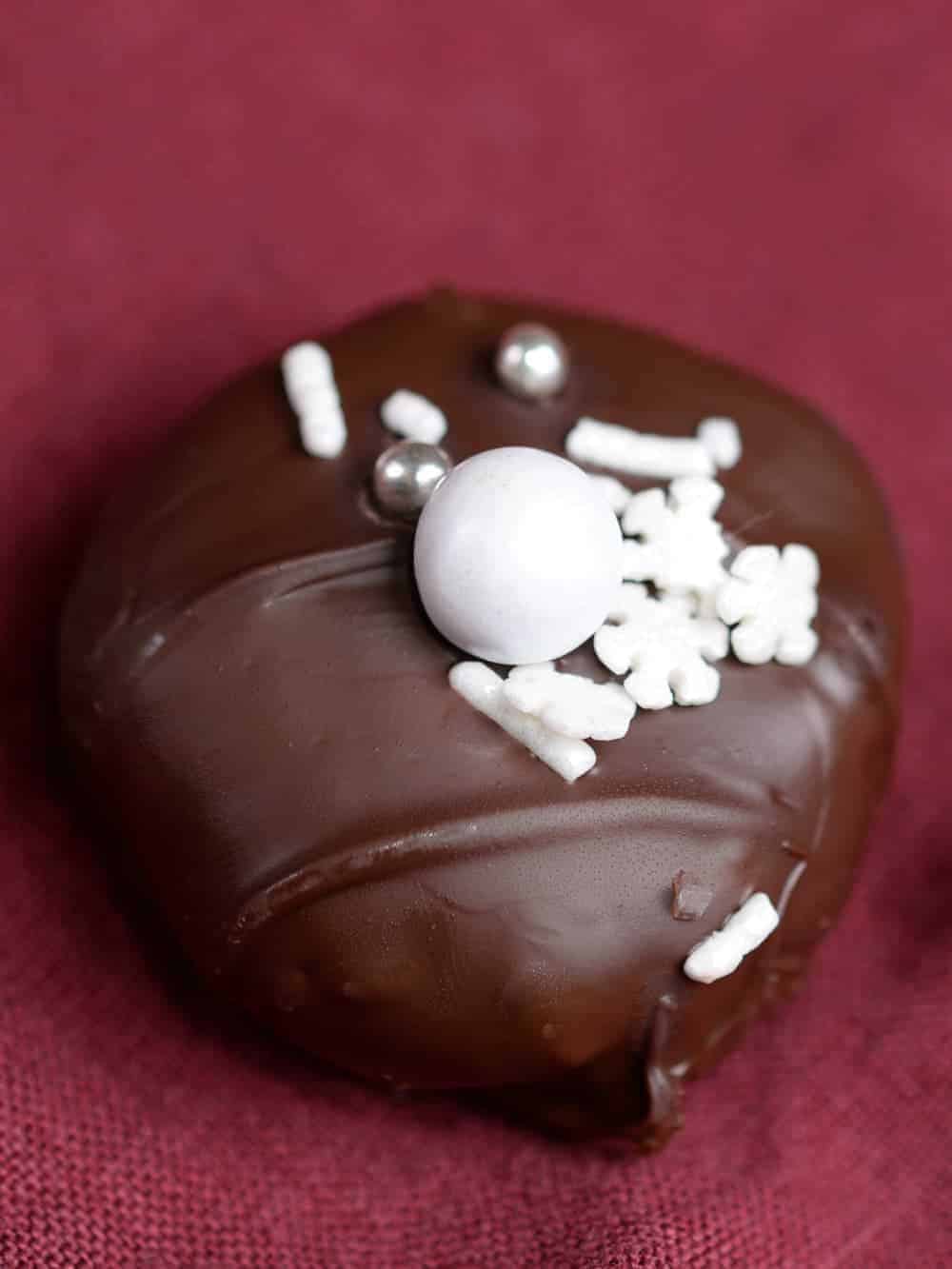 Homemade mounds candy with white Christmas sprinkles