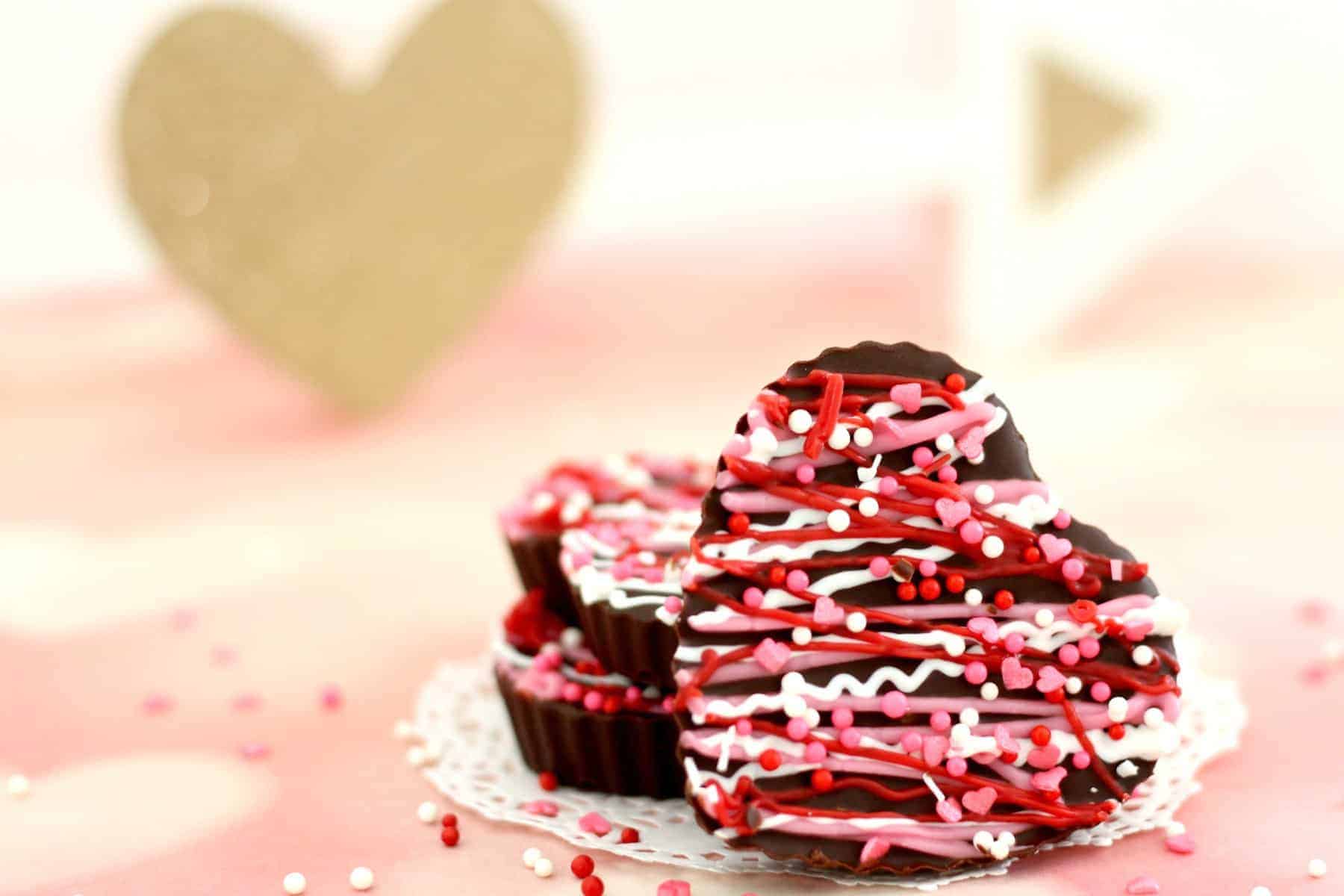 homemade dark chocolate hearts decorated with sprinkles