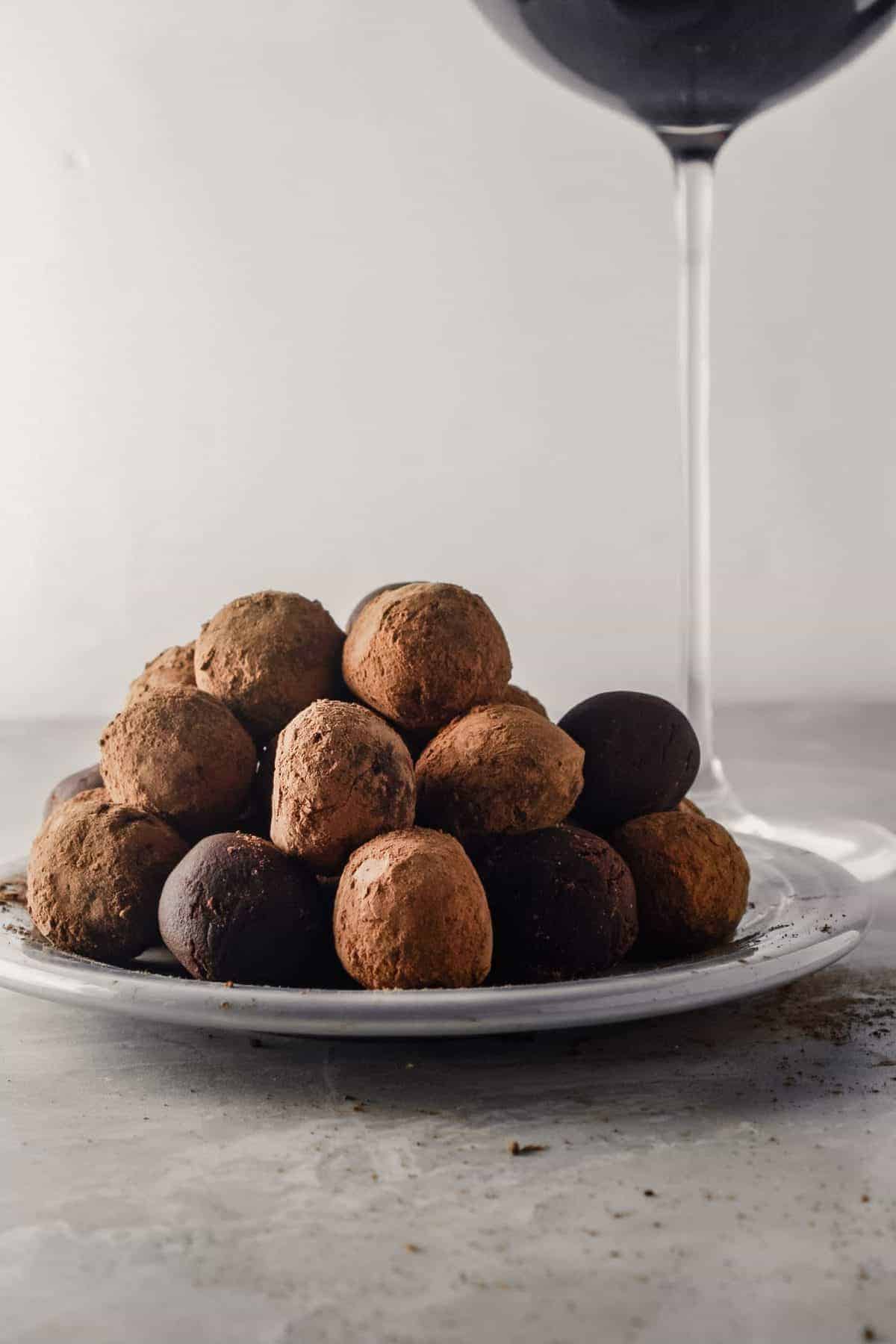 A plateful of truffles made with dark chocolate and red wine.