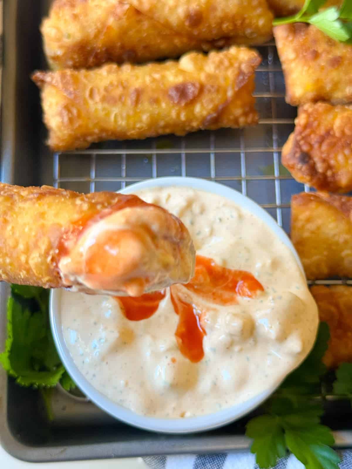 buffalo chicken eggrolls dipped in buffalo ranch dressing