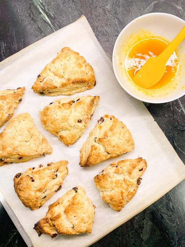 glaze the scones with an orange glaze