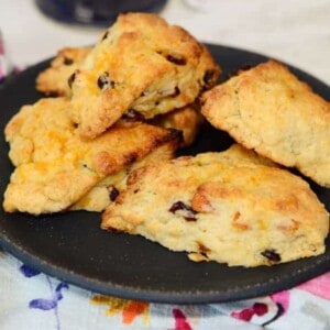 a plate of freshly baked cranberry orange scones