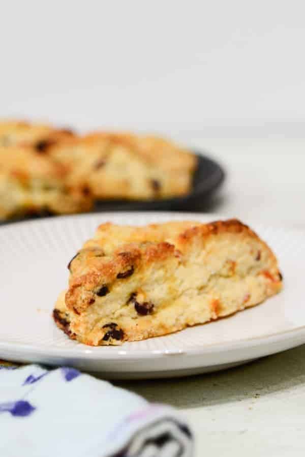 cranberry orange scone on a plate. 