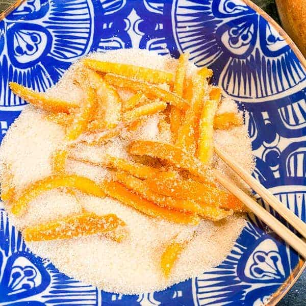 toss the dried but still slightly tacky candied orange peel in loose granulated sugar.