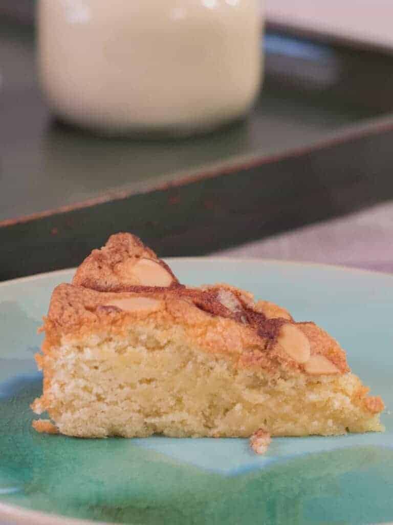 a slice of Scandanavian apple cake served with vanilla pasty cream on the side