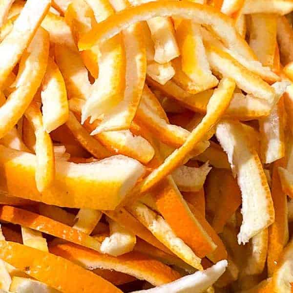 sliced orange peels ready to boil for making candied oranges.