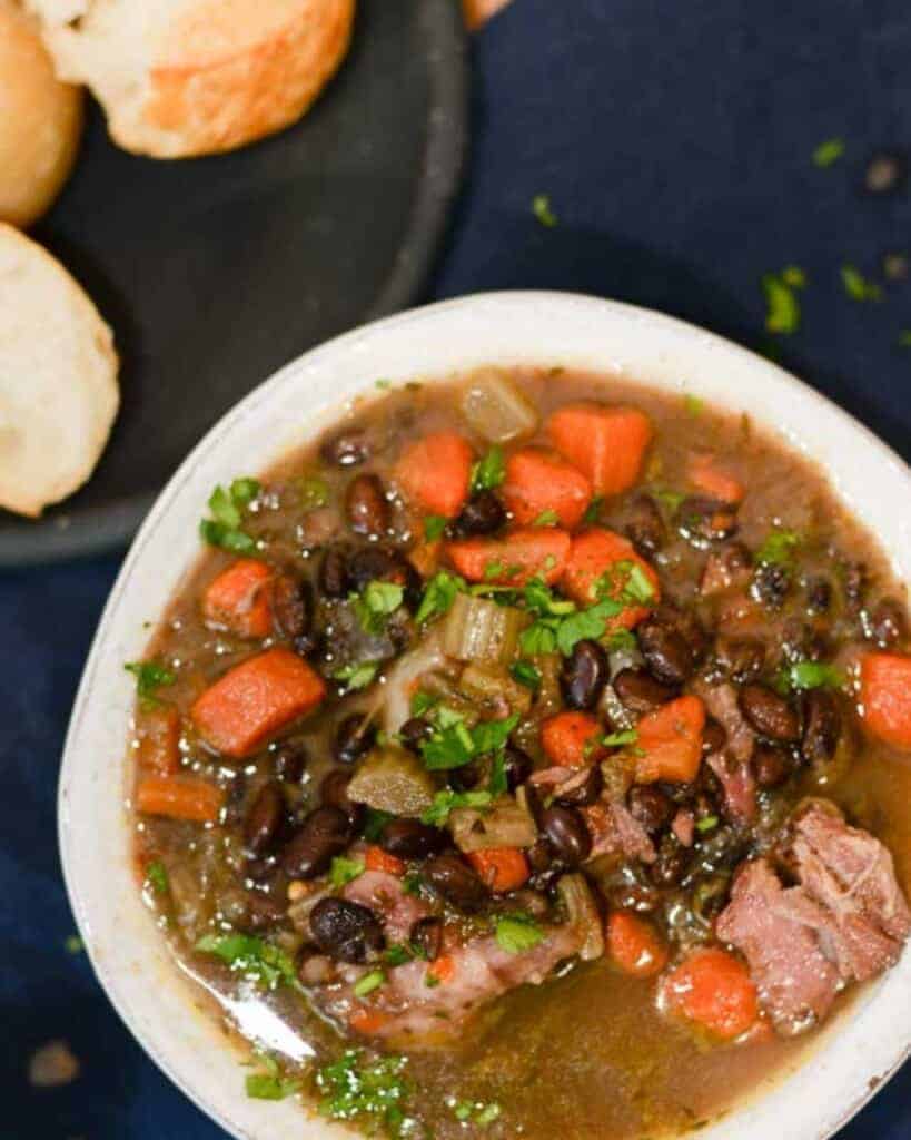 spicy black bean and ham soup recipe served with crispy french bread