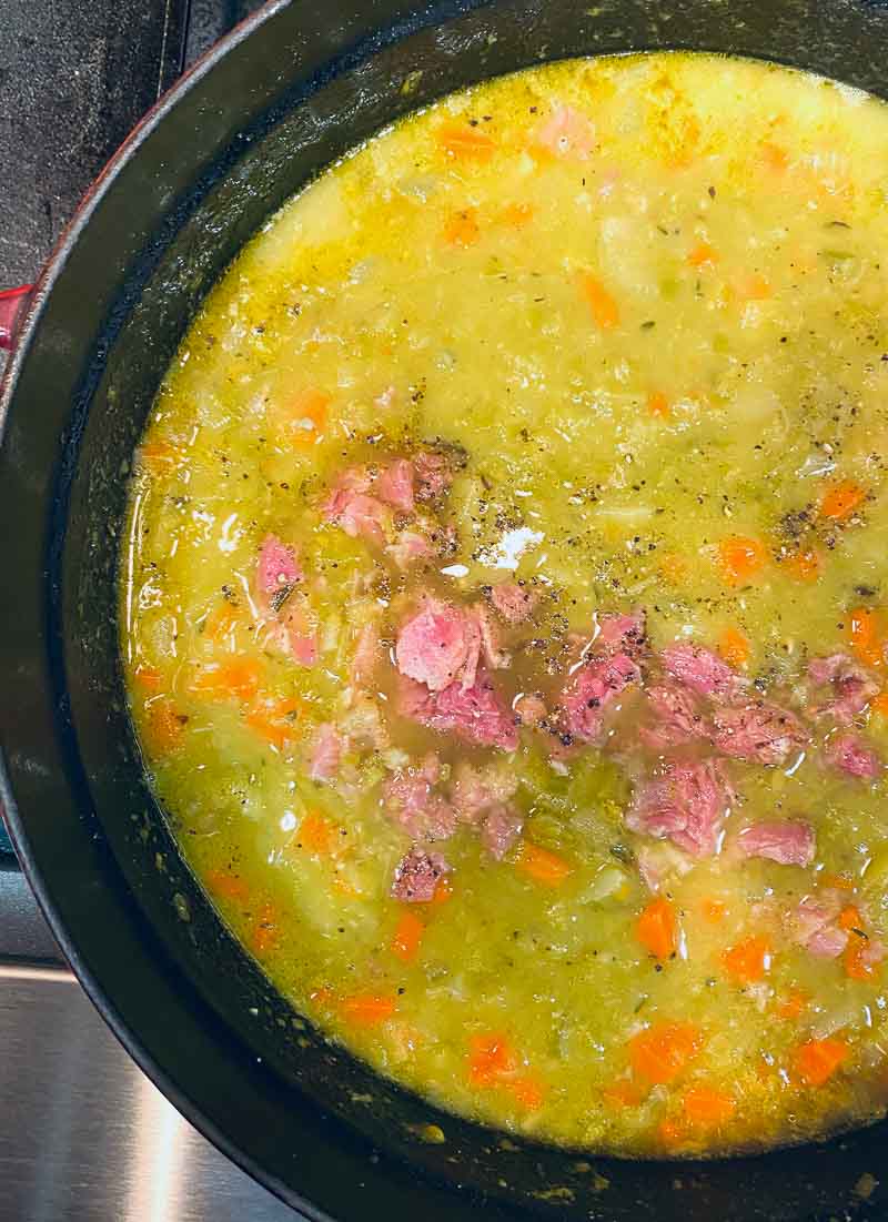 Pot of split pean soup with ham hock. In a Staub dutch oven.