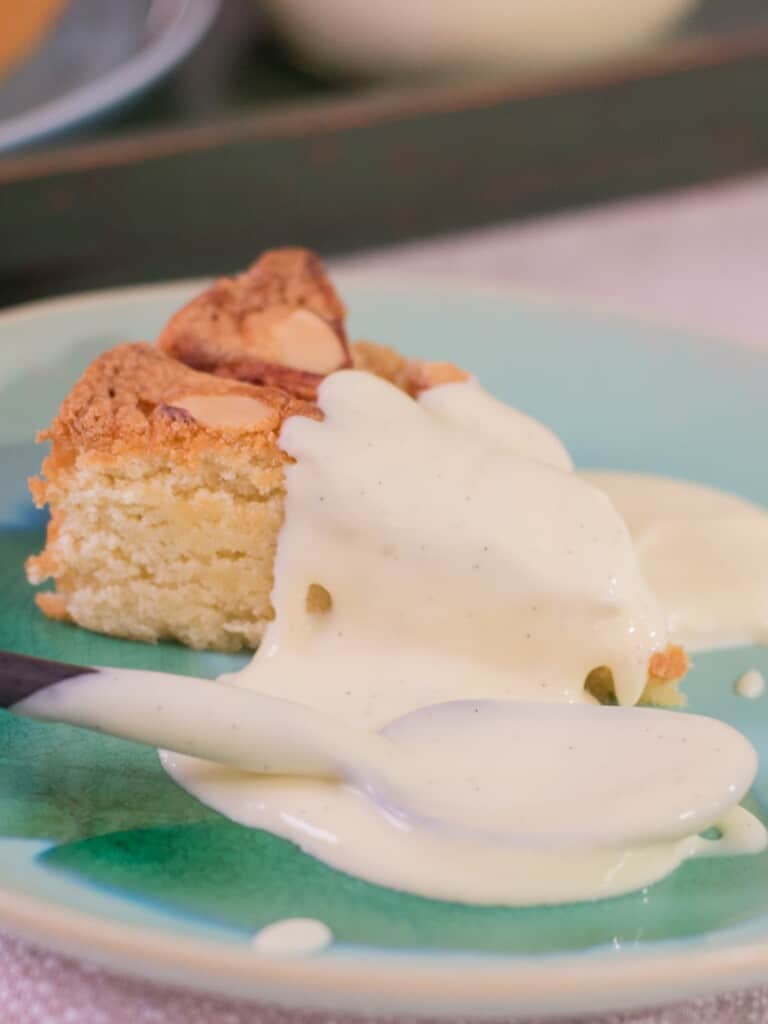 vanilla pastry cream topping on an apple cake