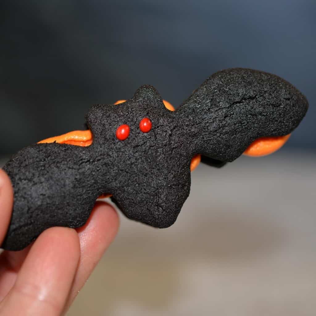 Bat shaped oreo cookies filled with orange buttercream. These homemade oreos are even better than the real thing.