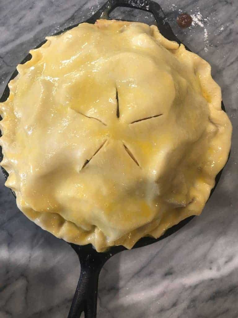 pie before baking in a cast iron pan