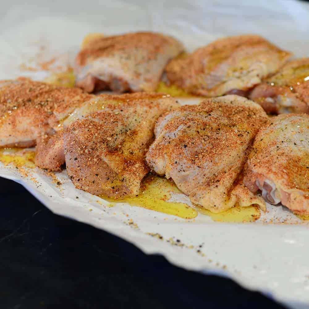 Add oil and the buffalo seasoning blend to the chicken thighs. 