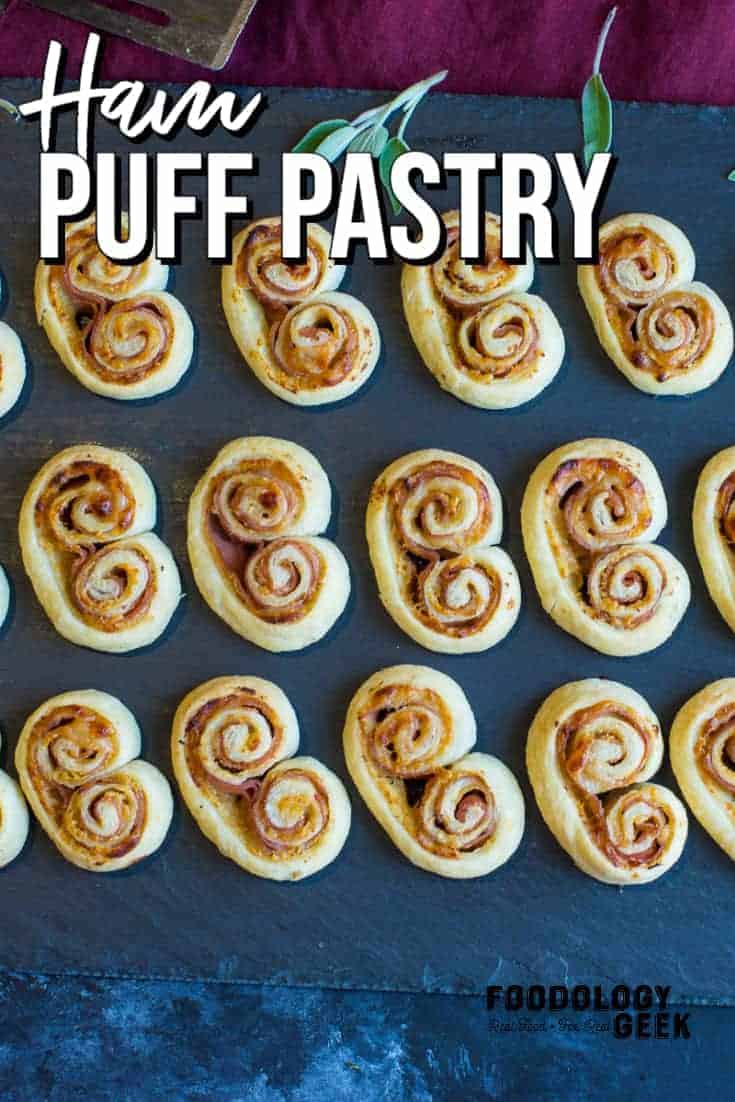 ham puff pastry appetizers on a black serving platter | foodology geek