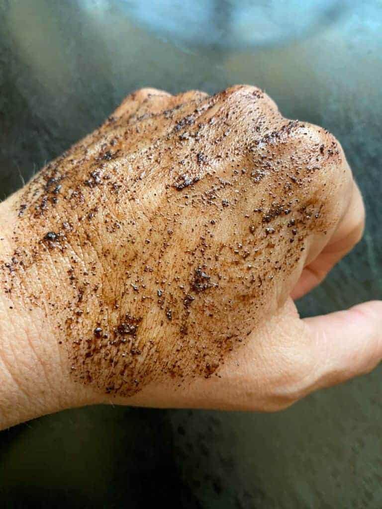 diy coffee body scrub on the back of my hand. recipe by foodology geek