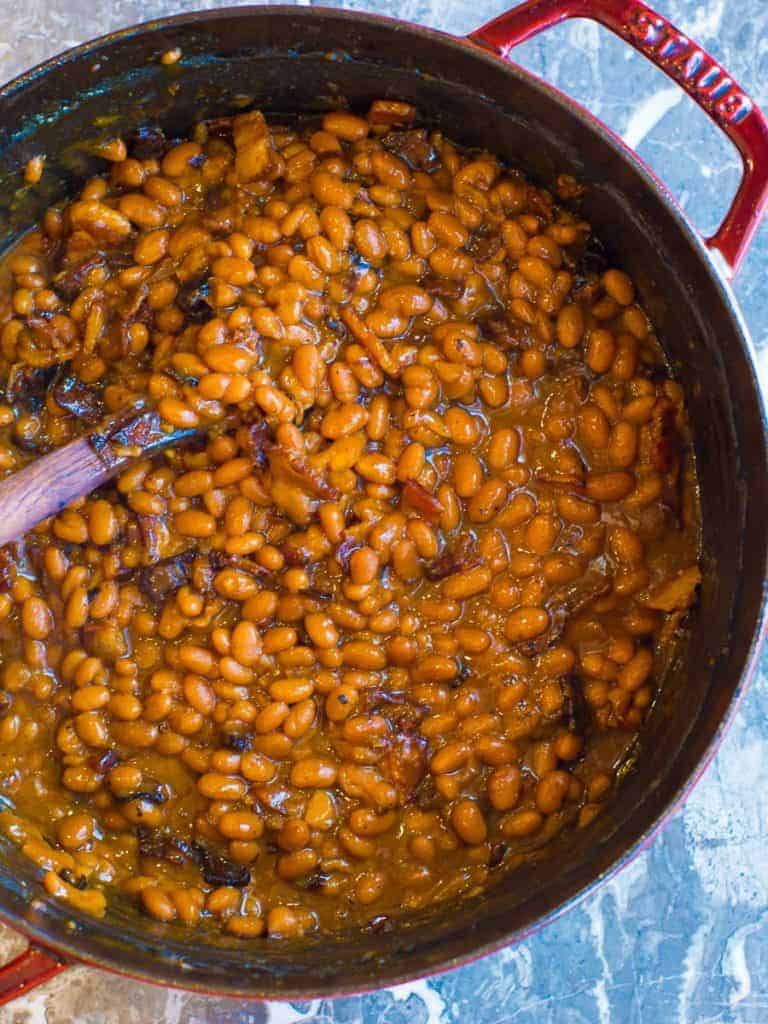 giant cast iron pot of baked beans | foodology geek