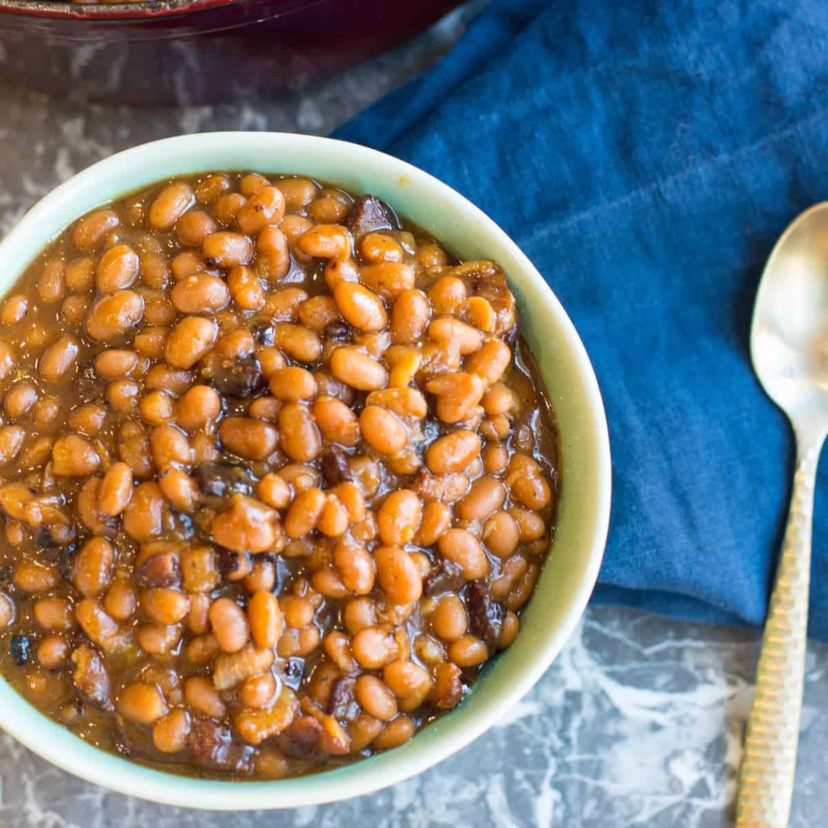 homemade baked beans in a green bowl