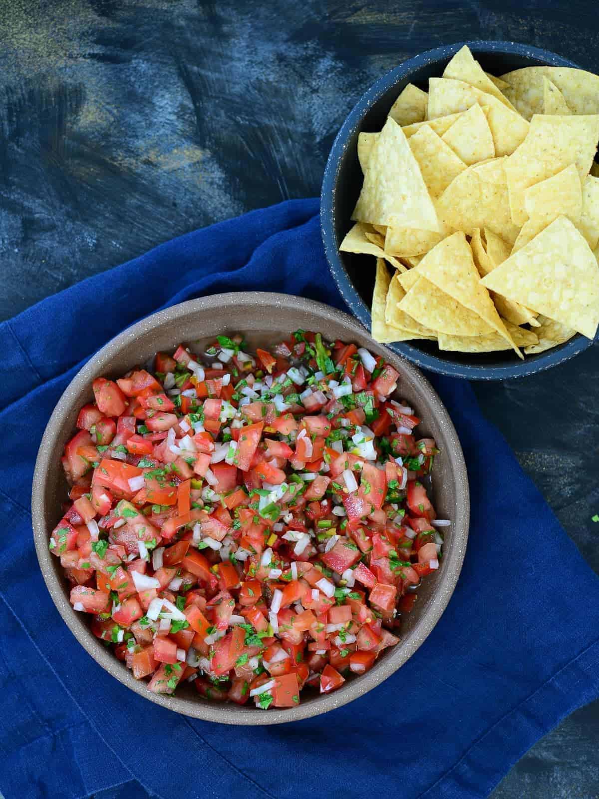 pico de gallo in a bowl, served with tortilla chips