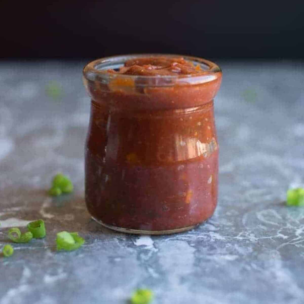 homemade tangy bbq sauce in a cute glass jar