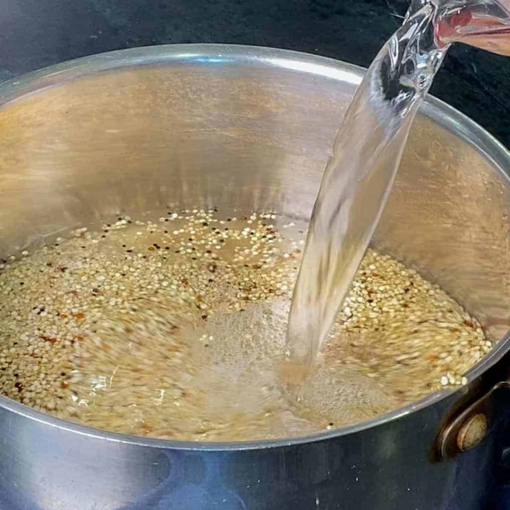 adding the water to quinoa before cooking