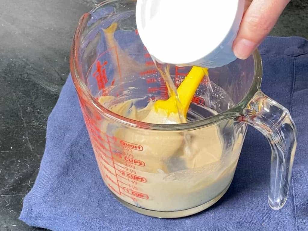 adding water to tahini dressing to thin it out