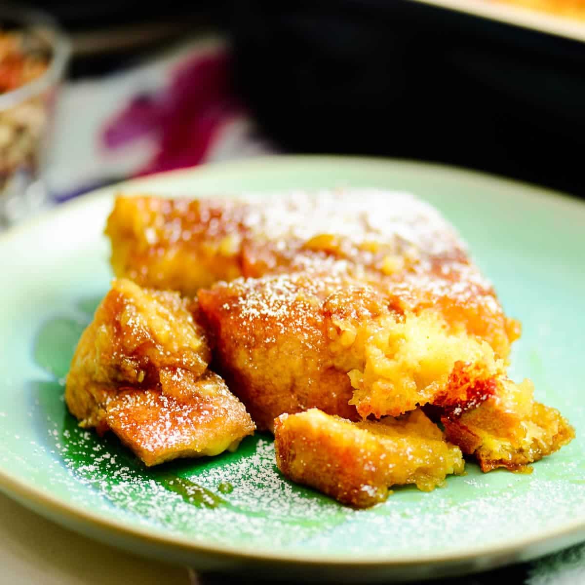 slice of baked french toast with powdered sugar