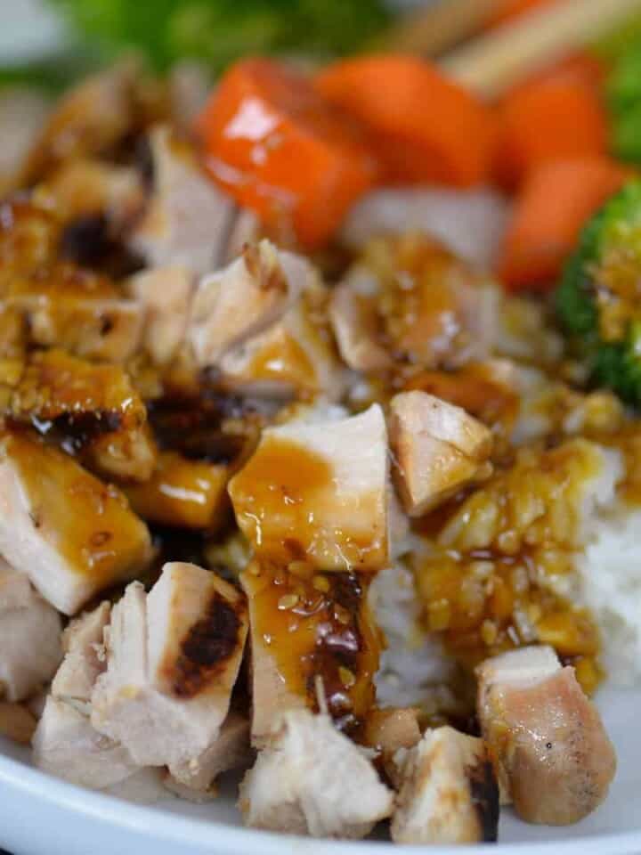 grilled teriyaki chicken bowl with grilled chicken thighs, steamed rice, and veggies