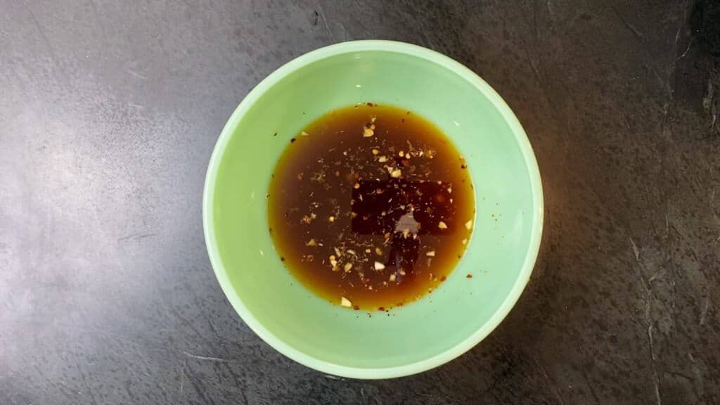 teriyaki marinade in a green bowl